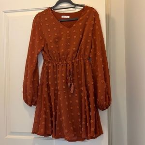 Long sleeve tie waist dress with polka dot details. Size small